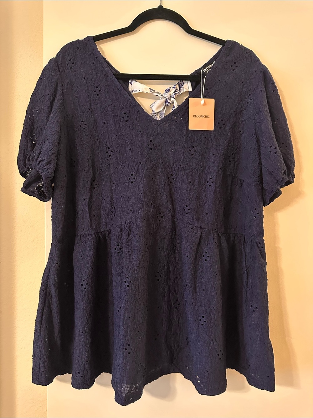 BloomChic Navy Eyelet V-Neck Peplum Tunic